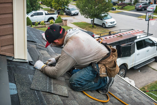 Professional Roof Replacement technician working in Bennett, IA